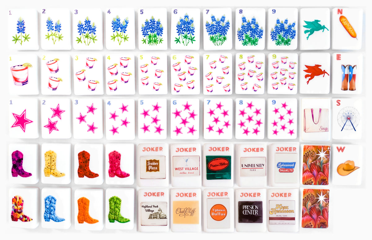 The full Dallas Collective mahjong set laid out in rows: bluebonnet, cocktail and star suits, winds, dragons, cowboy boot flowers and Jokers
